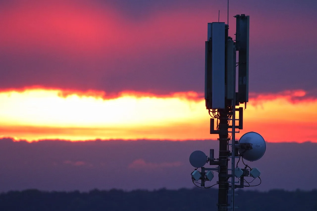 mobile telephone mast, tower, sunset, sky, dusk, twilight, nature, backlighting, transmission tower, transmitter, afterglow, internet. Rural Upload Needs for Livestream Host Sponsorships